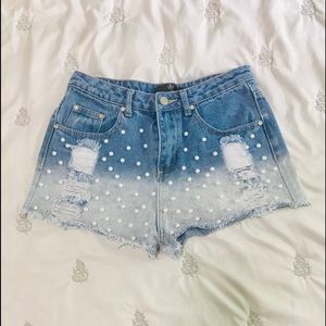 High-waisted distressed denim shorts